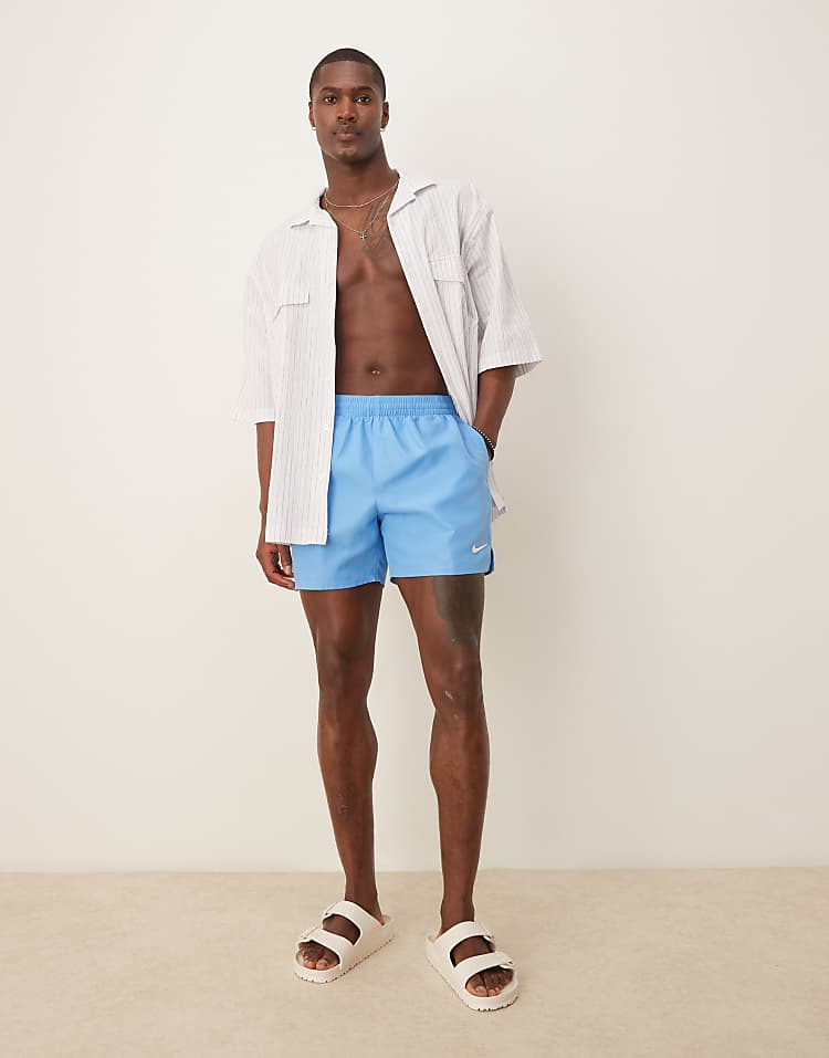 https://images.asos-media.com/products/nike-essential-lap-5-inch-volley-swim-shorts-in-blue/207808211-1-blue?$n_750w$&wid=750&fit=constrain