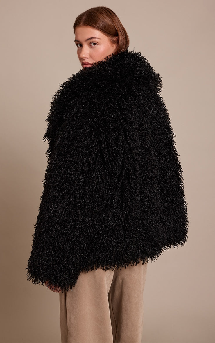 https://cdn-img.prettylittlething.com/2/5/f/2/25f2d7d0dd8454ca428b869f53d7da28411b045c_CNO1226_2_black_mongolian_fur_midi_coat.jpg