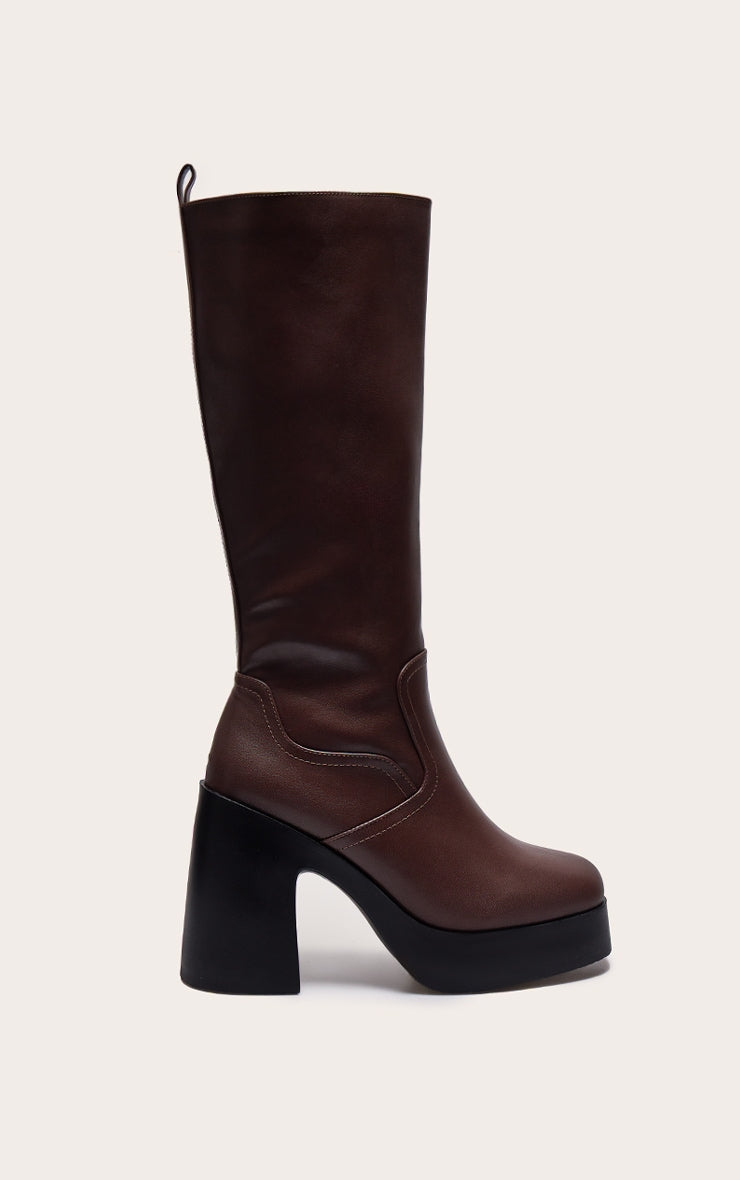 https://cdn-img.prettylittlething.com/3/2/8/5/3285d52f770f720723a3bb67ad0d525028bd06ba_CNL1914_1_chocolate_pu_wide_fit_square_toe_block_heel_slight_platform_knee_high_boots.jpg