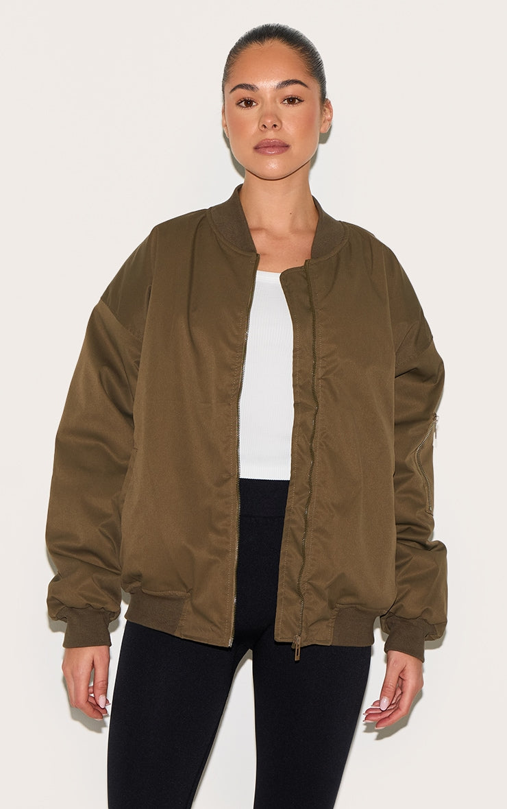https://cdn-img.prettylittlething.com/3/a/7/a/3a7a8fc20b2ee4850f6f8c674ea1f350ef753304_CNL4138_1_khaki_classic_oversized_bomber_jacket.jpg