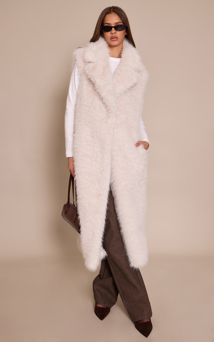 https://cdn-img.prettylittlething.com/3/d/8/c/3d8cd9a1c2a91631d27f2d4d316ec06adfe4b7cb_CNO0316_3_cream_faux_fur_maxi_gilet.jpg