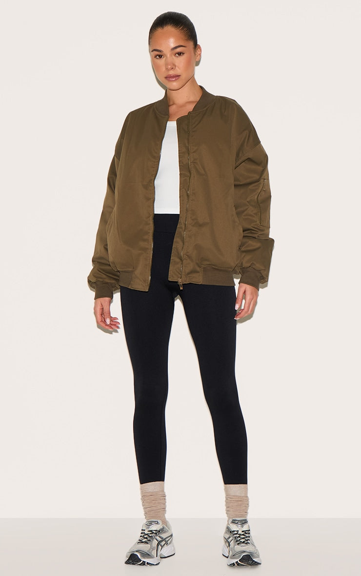 https://cdn-img.prettylittlething.com/6/1/0/6/610686adcbdb7b08c5073d6406a222db25e9e0cb_CNL4138_3_khaki_classic_oversized_bomber_jacket.jpg