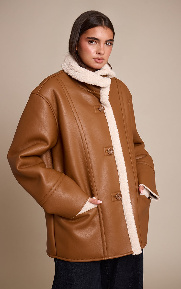 https://cdn-img.prettylittlething.com/7/b/0/f/7b0ff06094319de81e3e63c254e1233ae82963ed_CNO2900_1_tan_faux_leather_funnel_neck_aviator_coat.jpg