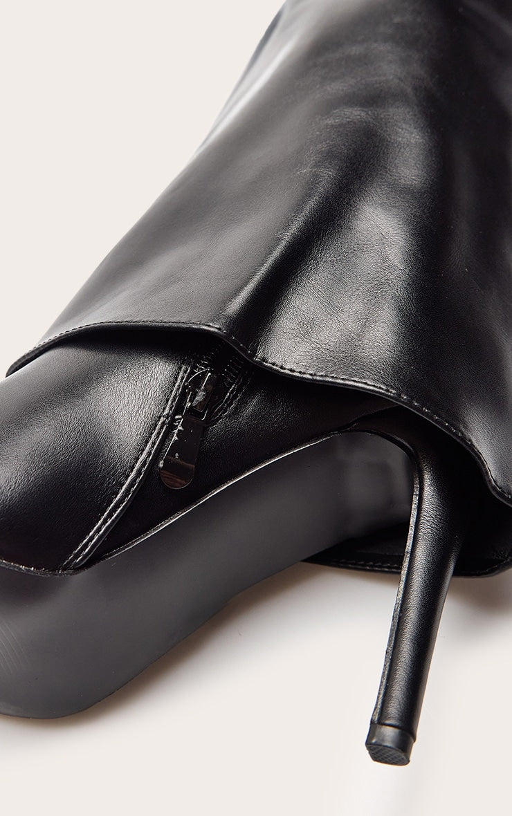 https://cdn-img.prettylittlething.com/8/7/8/9/878987755c69a03ea9ac72bc77fb928733ca6b44_CNP8670_5_black_faux_leather_stiletto_foldover_knee_high_boot.jpg