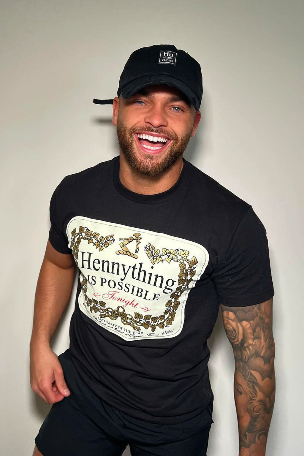 https://cdn.shopify.com/s/files/1/0293/9277/products/HennythingIsPossibleShortSleeveCrewTee-Black_mer_88a1845c-765f-47ed-a737-276b713bb608.jpg?v=1649978388