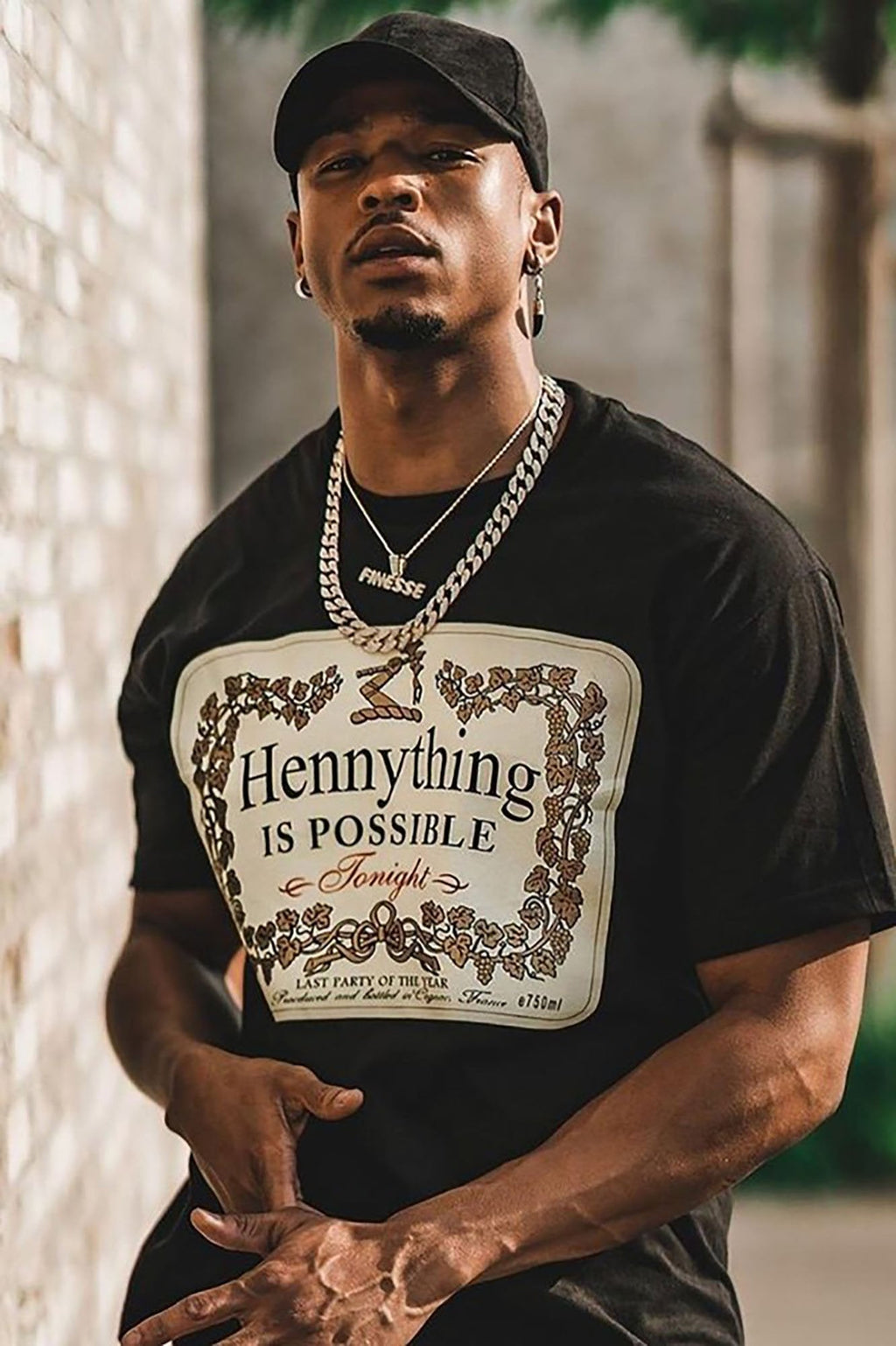 https://cdn.shopify.com/s/files/1/0293/9277/products/Hennything_Is_Possible_Short_Sleeve_Crew_Tee_-_Black_MH.jpg?v=1611964536