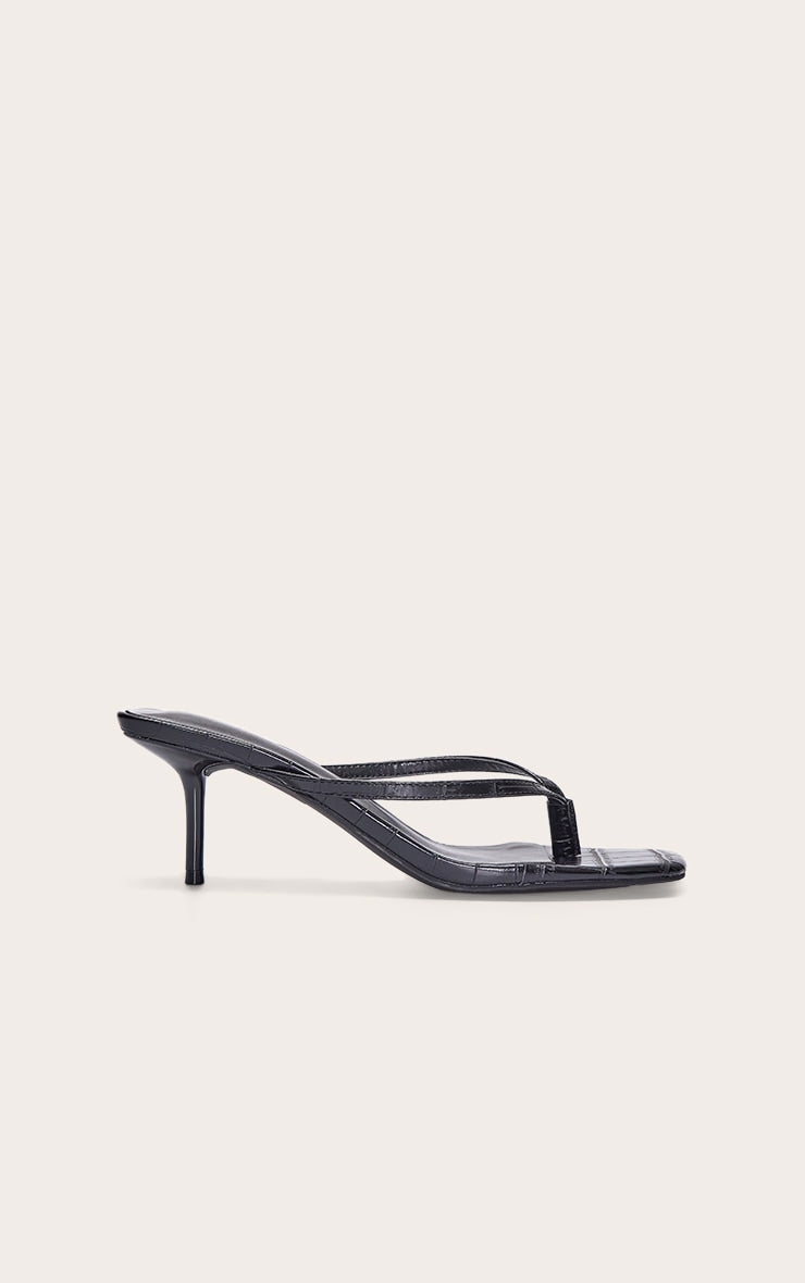https://cdn-img.prettylittlething.com/c/c/4/e/cc4ebaa9eae70db0f92b5c28446e491006ae37b4_CNL6802_1_black_pu_square_toe_thong_mid_stiletto_heeled_mules.jpg