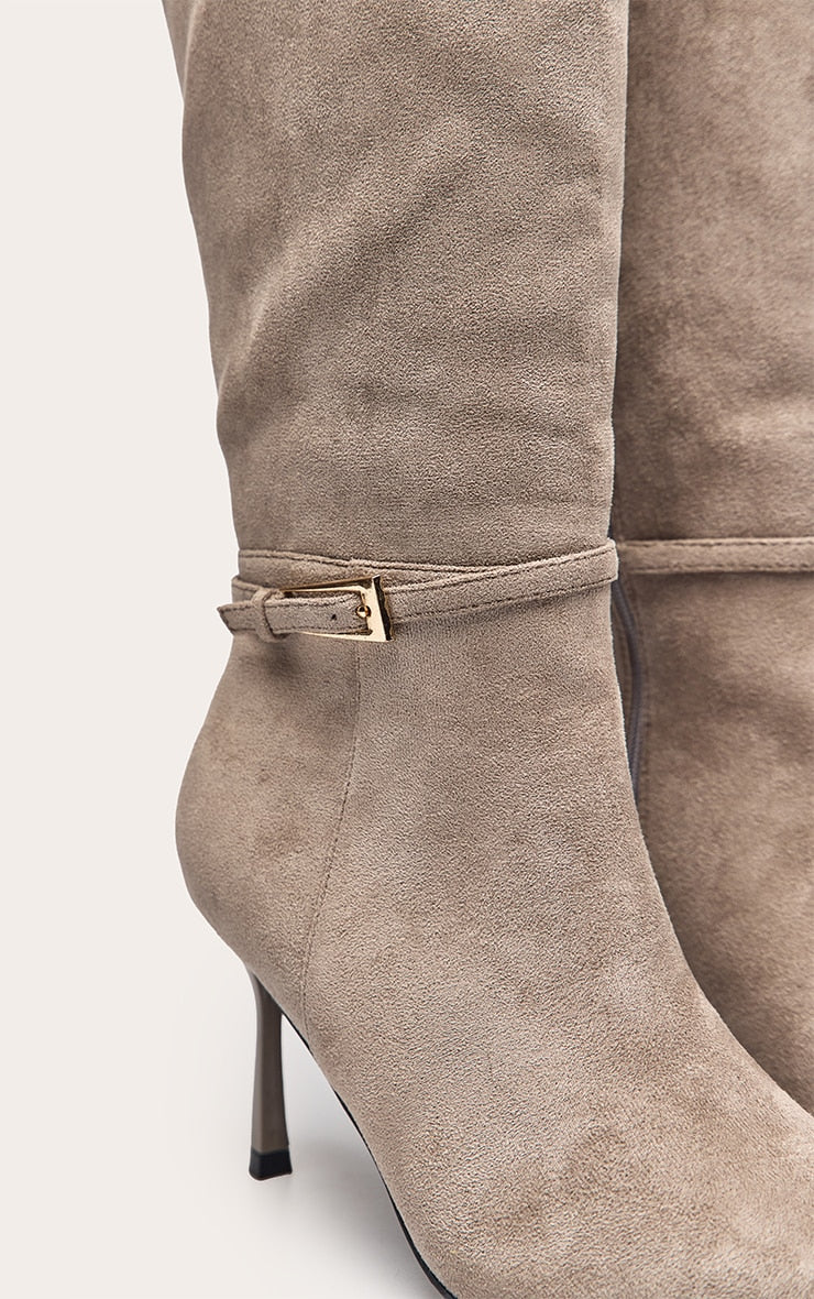 https://cdn-img.prettylittlething.com/f/7/7/7/f777de8d9a9c6c1af61ee1a572c6e68d35175d77_CNO8427_5_mushroom_faux_suede_buckled_knee_high_stiletto_heeled_boot.jpg